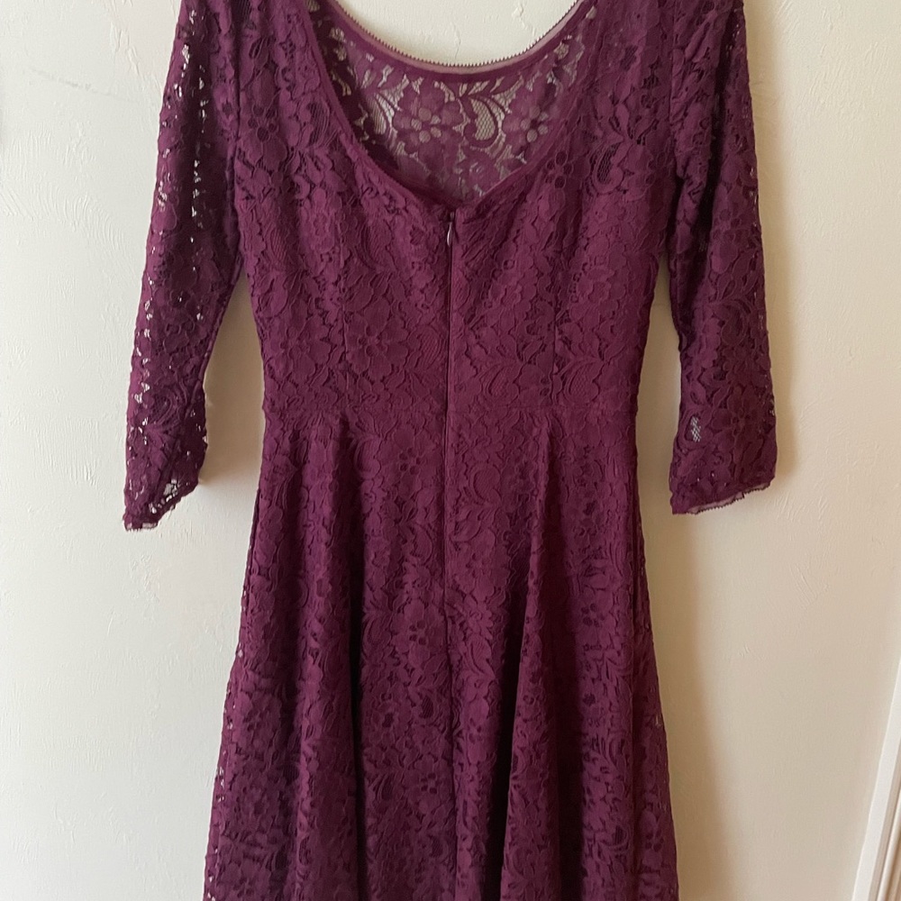 Beautiful maroon lacy dress lined  with accented waist to flatter your figure